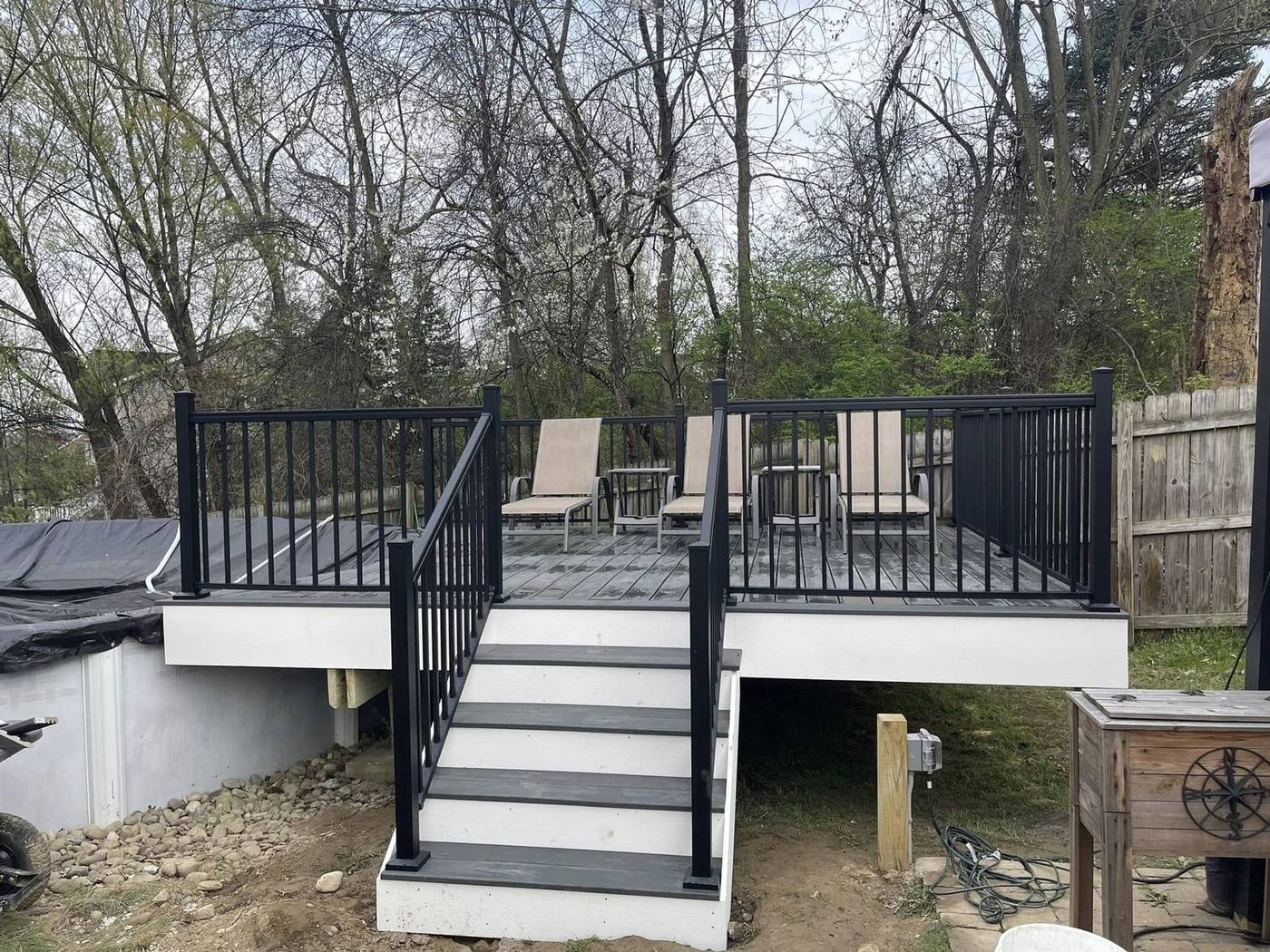 Poolside deck with black aluminum railing