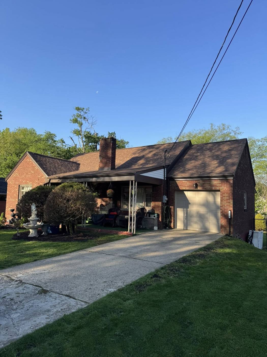 Brick ranch with new roof and matching dark brown soffit, fascia and gutters
